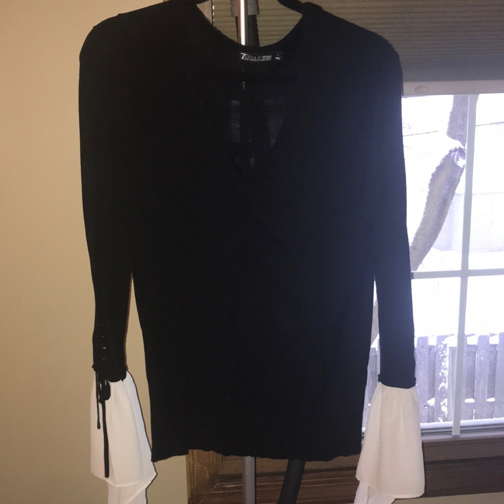 Cute black sweater with fun white sleeves